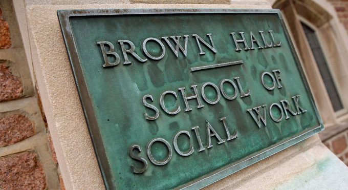 Plaque outside Brown Hall, 2007. On July 1, 1945, the George Warren Brown Department of Social Work becomes a School of Social Work.