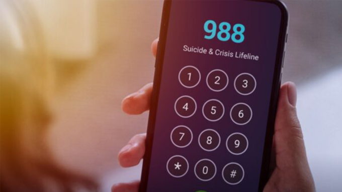 Phone screen showing 988 Suicide & Crisis Lifeline keypad, indicating a crisis hotline access on a mobile device