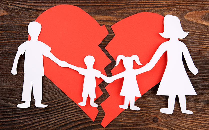 Picture of paper family with broken heart.