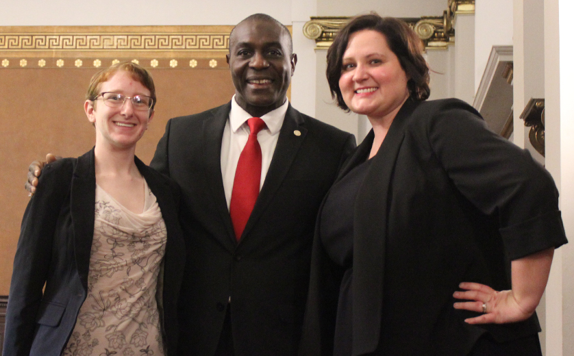 MSW/MSP students Kate Polokonis and Jodie Goodman pose with Board President Lewis Reed