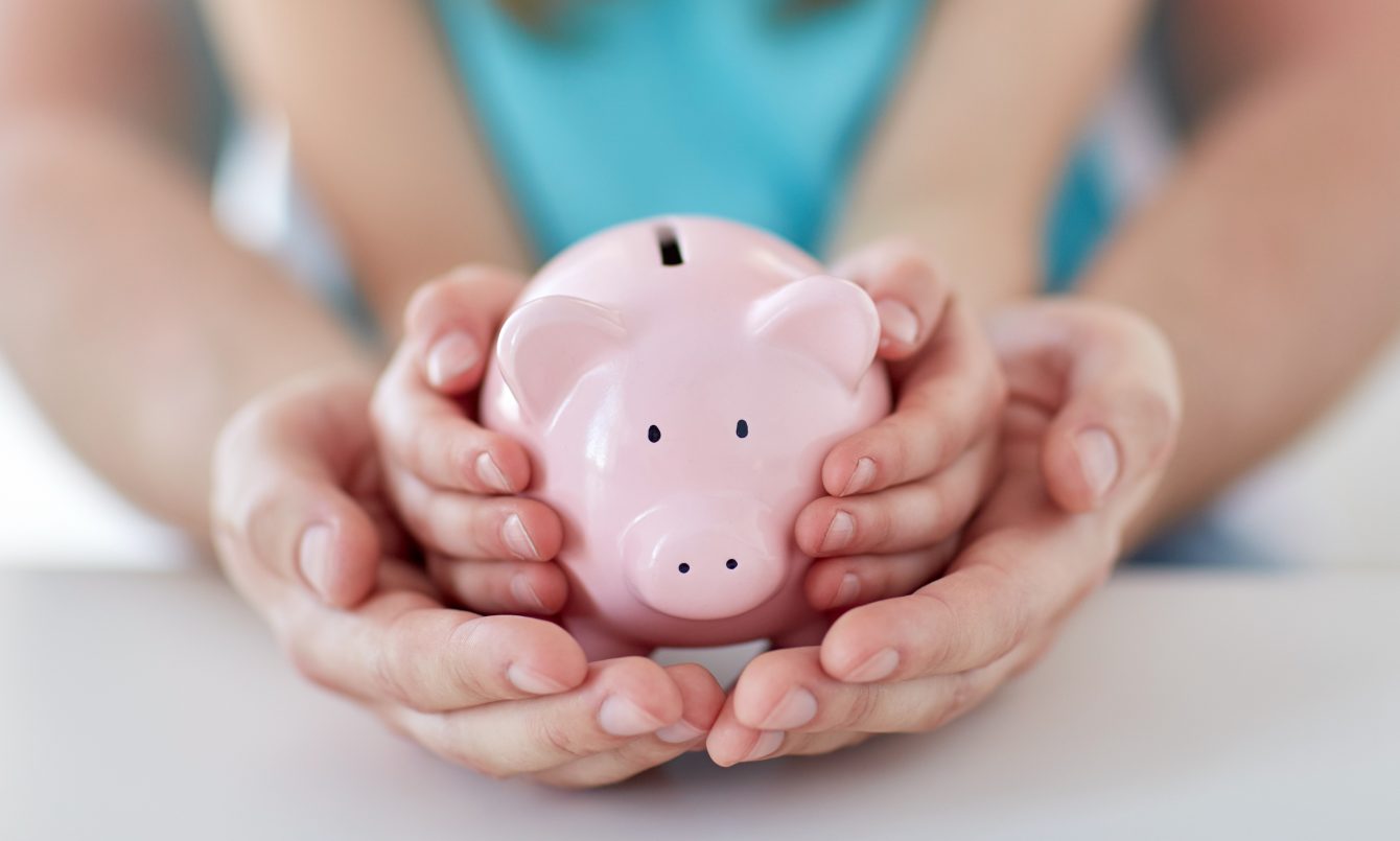 Parent and child with piggy bank