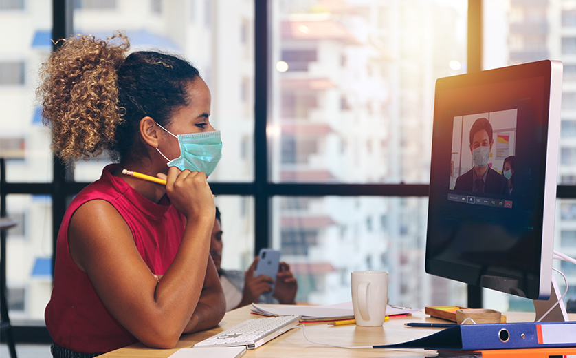 Student and professor wear masks for a remote video class