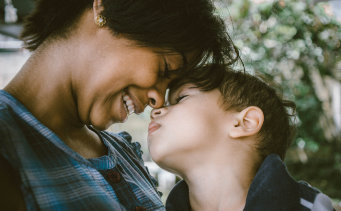 Image of a parent hugging their child