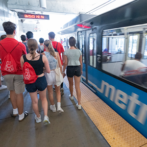 People getting on the metro. 